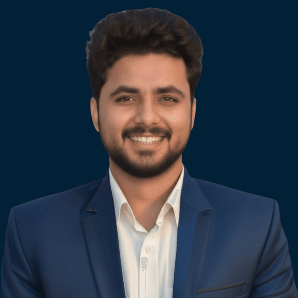 Professional portrait in a navy suit on a dark background